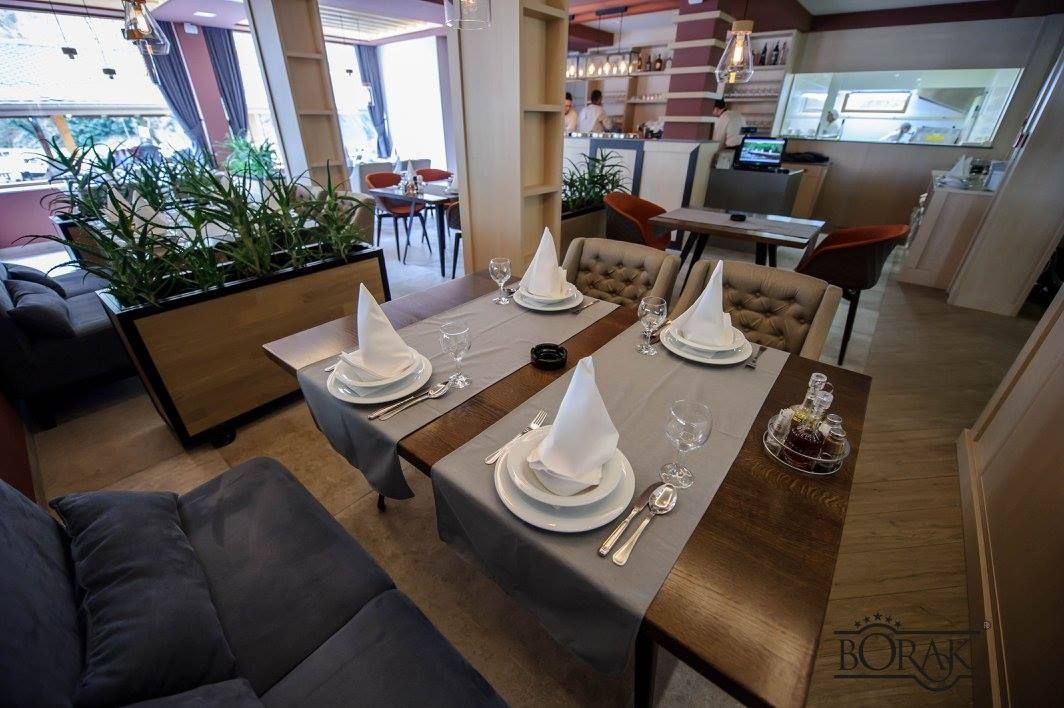 Rustic restaurant interior with warm wooden and stone details